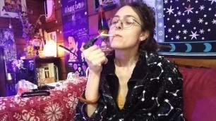 Sexy Hippie Goddess Girl with Dreadlocks Lights and Smokes Cigarette