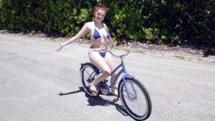 Annabel Redd is riding the bike and showing off her big boobs - Porn Movies - 3Movs